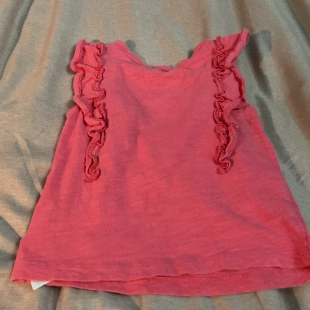 2 sleeveless shirts
